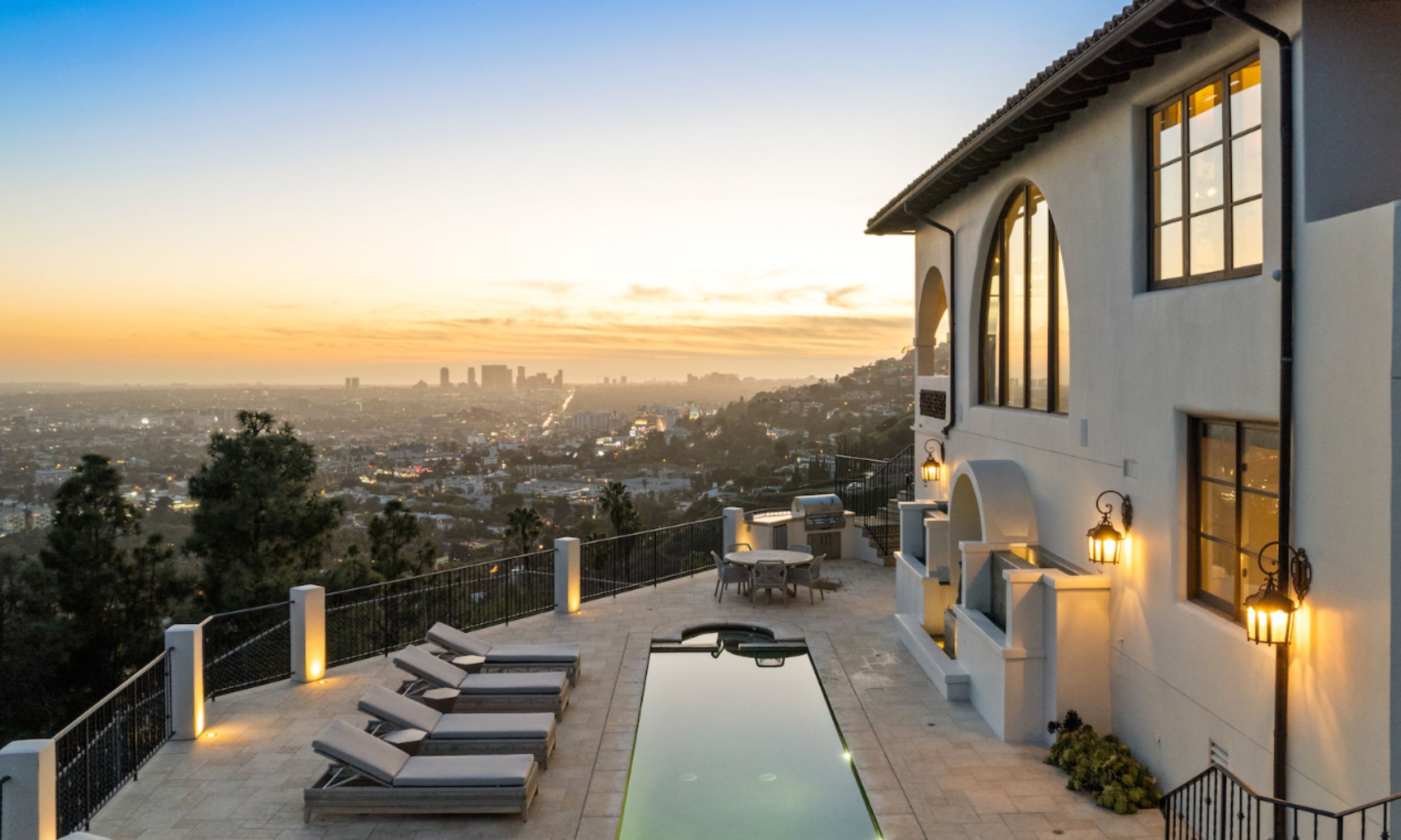 The image depicts a serene outdoor oasis within a luxury treatment facility, featuring comfortable seating areas that encourage relaxation and reflection. This peaceful setting is designed to support individuals undergoing drug addiction treatment and promote their overall well-being during the recovery process through chemical dependency treatment.